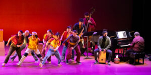 Ephrat Asherie dancers and Arturo O'Farrill on stage performing Shadow Cities