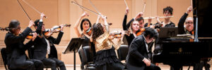 Orpheus Chamber Orchestra and Nobuyuki Tsujii perform on stage