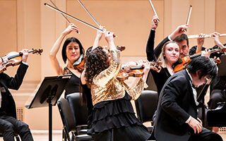 Orpheus Chamber Orchestra and Nobuyuki Tsujii perform on stage