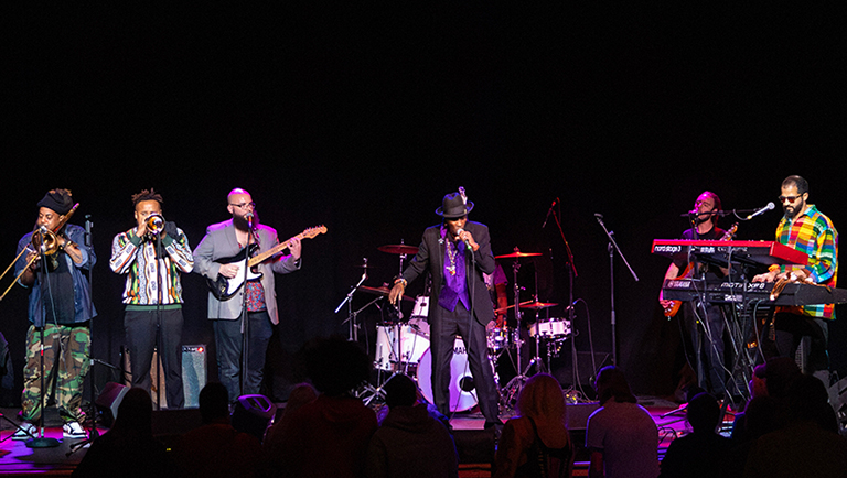 Songs of the Spirit musicians jamming on stage